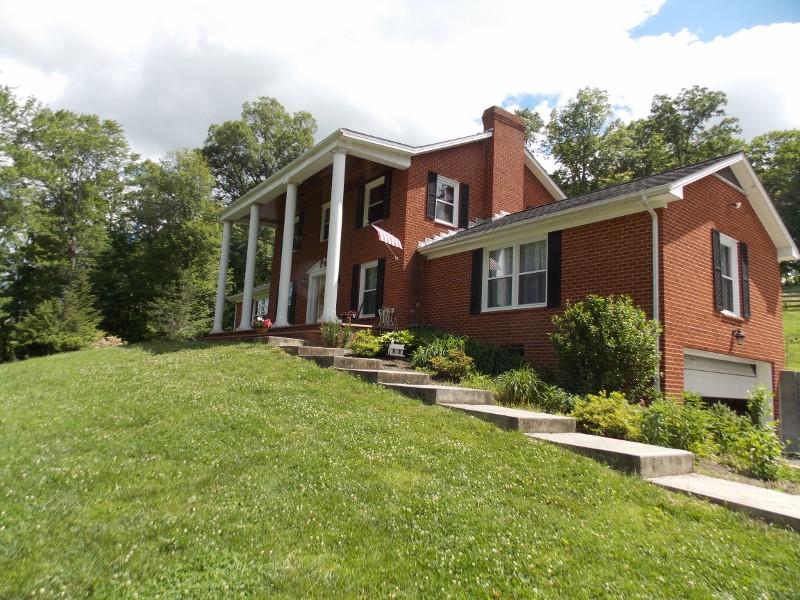 1612 Stonewall Road Northeast Check, VA 24072 - Photo 1 of 43 front view of a house with a yard