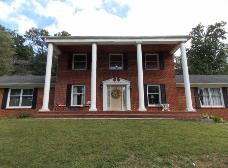 1612 Stonewall Road Northeast Check, VA 24072 - Photo 2 of 43 a front view of a house with a yard