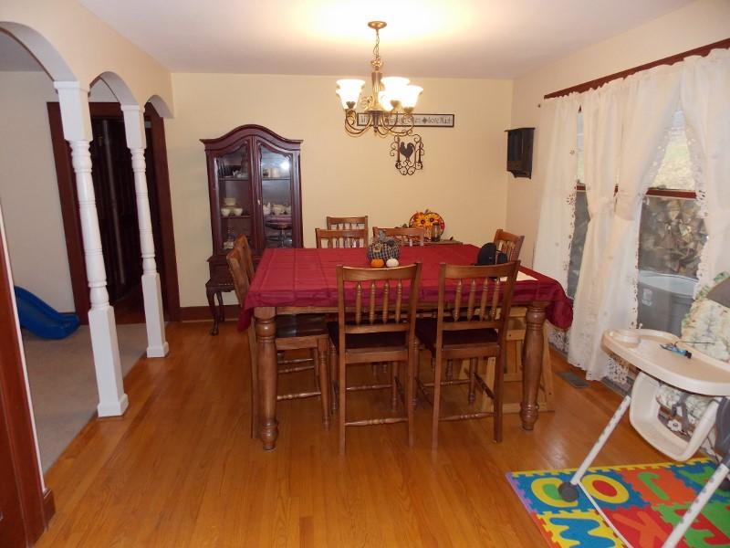 1612 Stonewall Road Northeast Check, VA 24072 - Photo 12 of 43 a view of a dining room with furniture and wooden floor