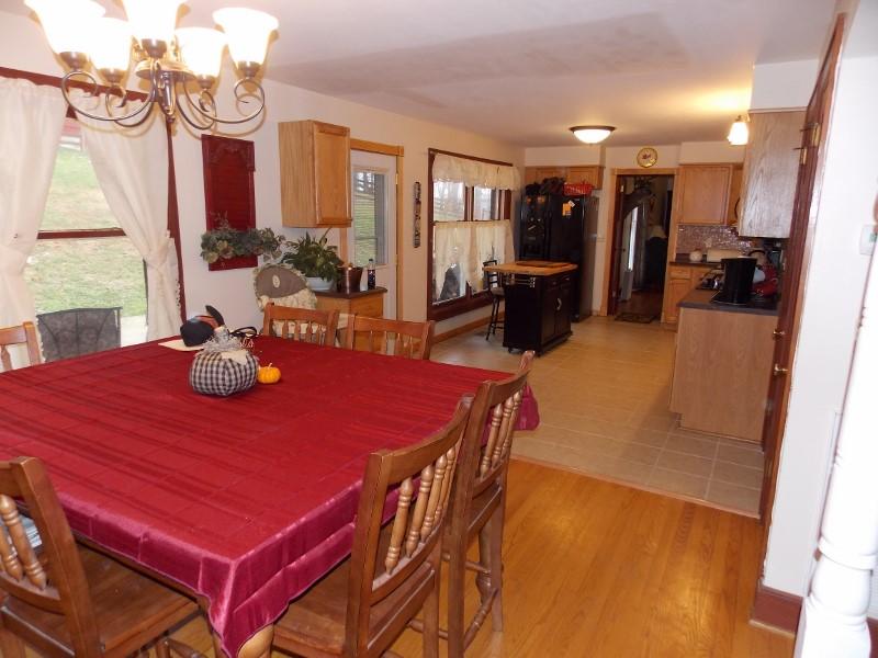 1612 Stonewall Road Northeast Check, VA 24072 - Photo 13 of 43 a view of a dining room with furniture and a chandelier