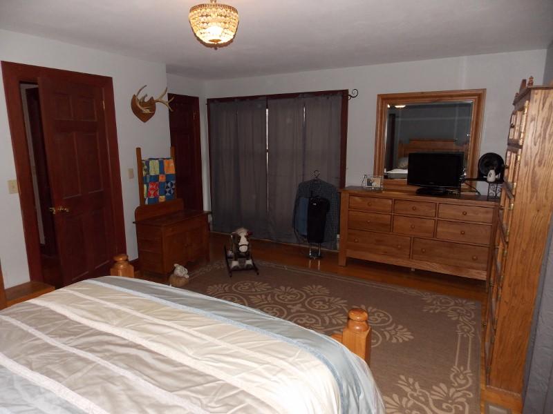 1612 Stonewall Road Northeast Check, VA 24072 - Photo 19 of 43 a bedroom with a bed and a television