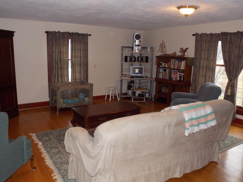 1612 Stonewall Road Northeast Check, VA 24072 - Photo 20 of 43 a living room with furniture a bookshelf and a window