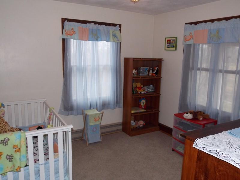 1612 Stonewall Road Northeast Check, VA 24072 - Photo 21 of 43 a bedroom with furniture and wooden floor