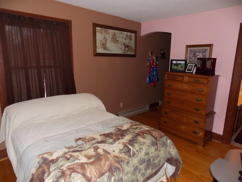 1612 Stonewall Road Northeast Check, VA 24072 - Photo 24 of 43 a bedroom with a bed and a dresser