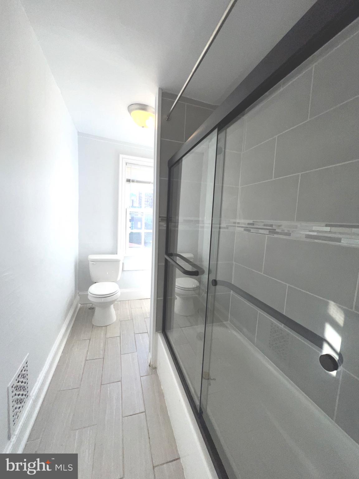405 North 2nd Street Camden, NJ 08102 - Photo 10 of 15 a bathroom with a bathtub and a shower