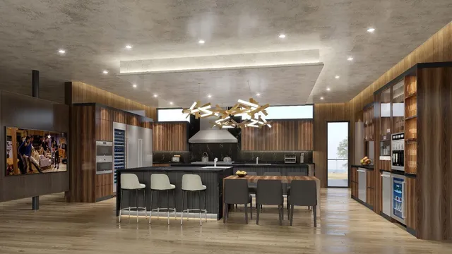 a kitchen with stainless steel appliances kitchen island granite countertop a table and chairs in it