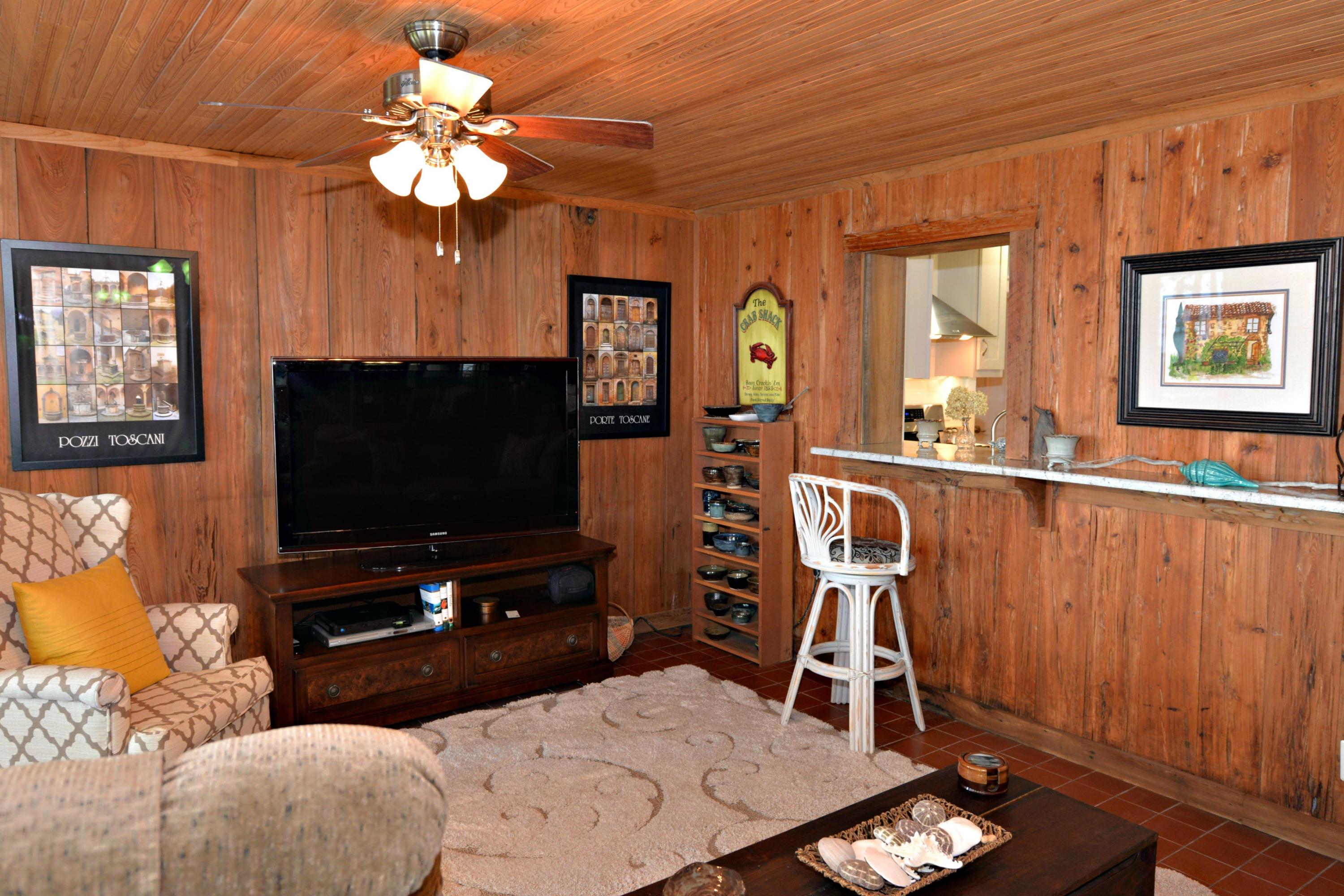 2394 Bay Grove Road Freeport, FL 32439 - Photo 11 of 37 a living room with furniture and a flat screen tv