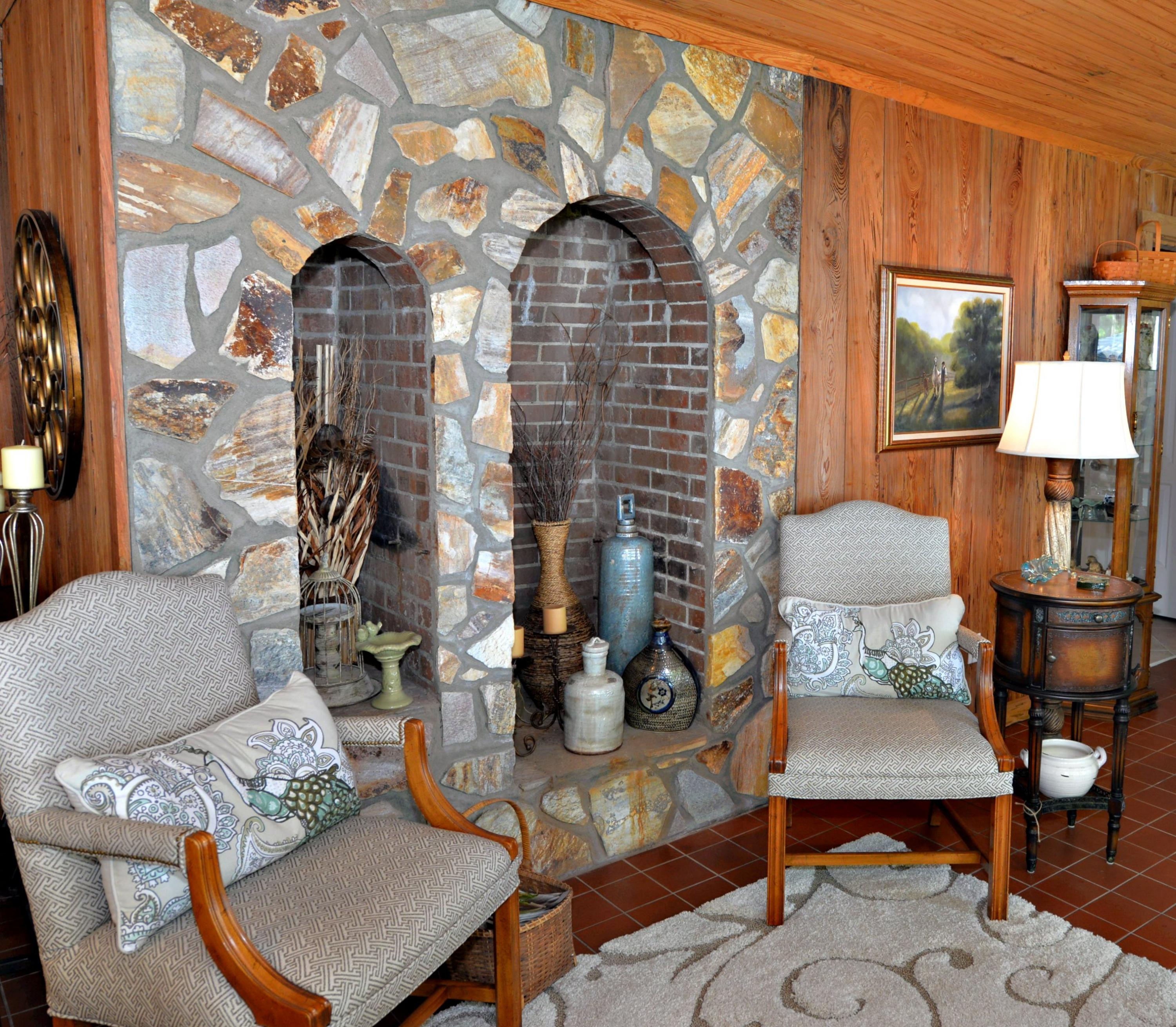 2394 Bay Grove Road Freeport, FL 32439 - Photo 13 of 37 a living room with furniture a flat screen tv and a table