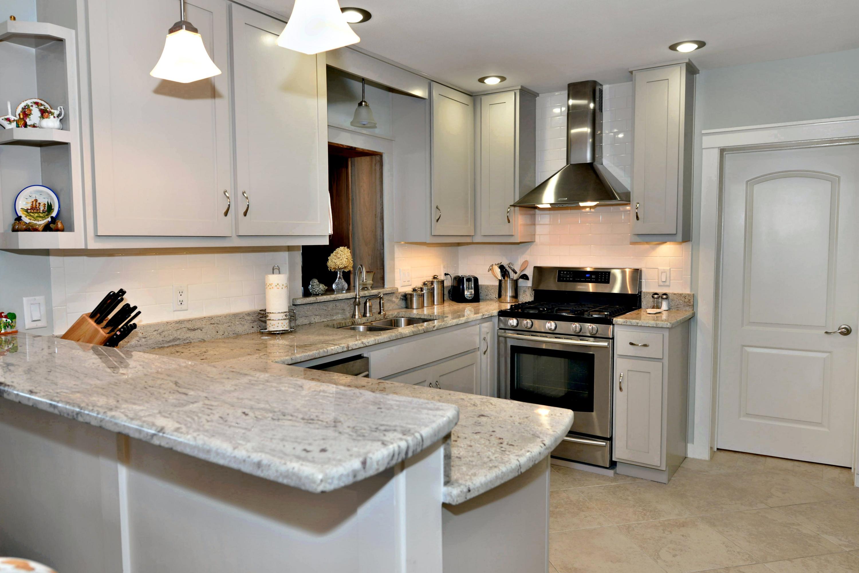 2394 Bay Grove Road Freeport, FL 32439 - Photo 3 of 37 a kitchen with stainless steel appliances granite countertop a sink stove and cabinets
