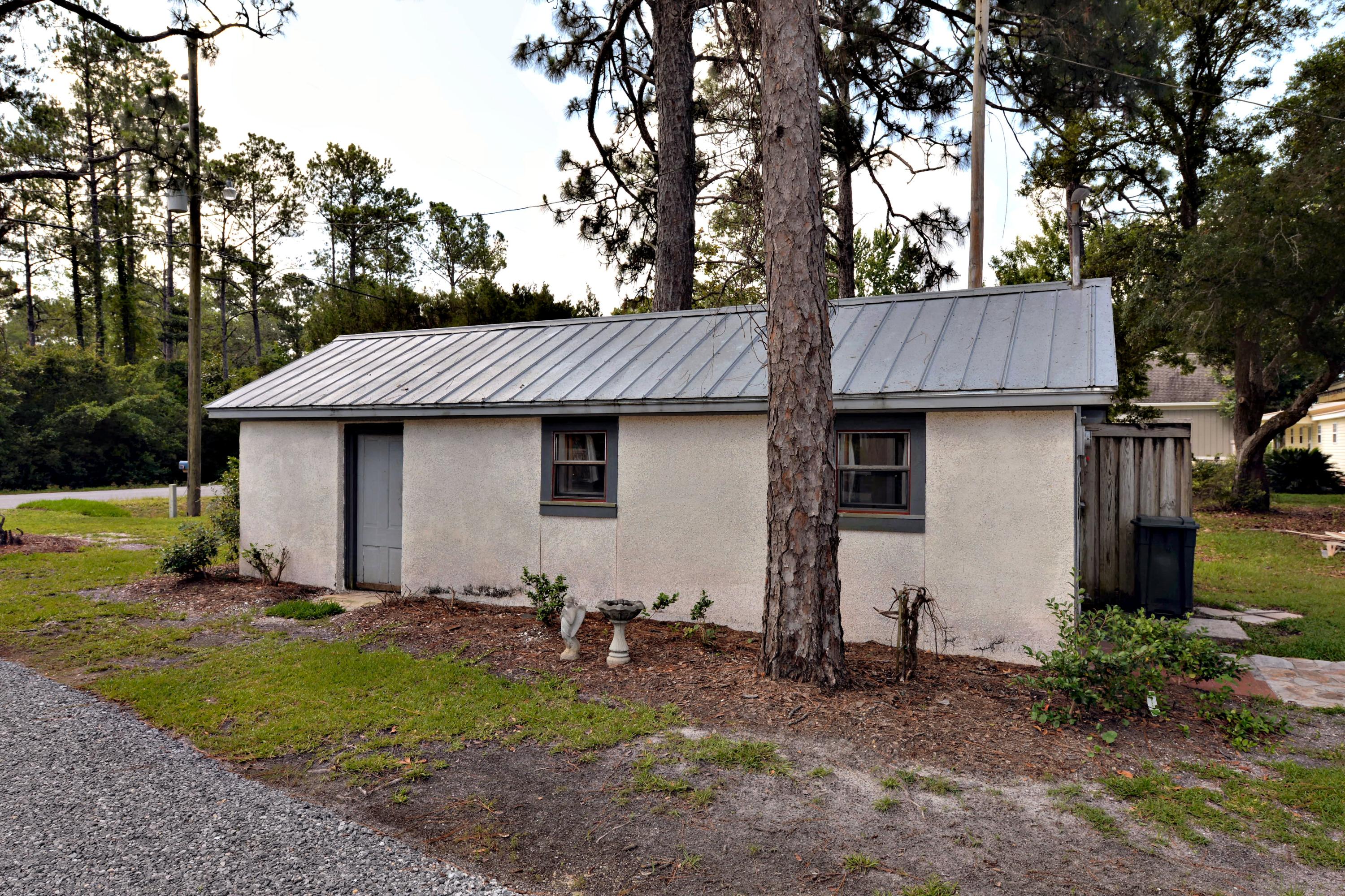 2394 Bay Grove Road Freeport, FL 32439 - Photo 36 of 37 a view of a yard with barn and large trees
