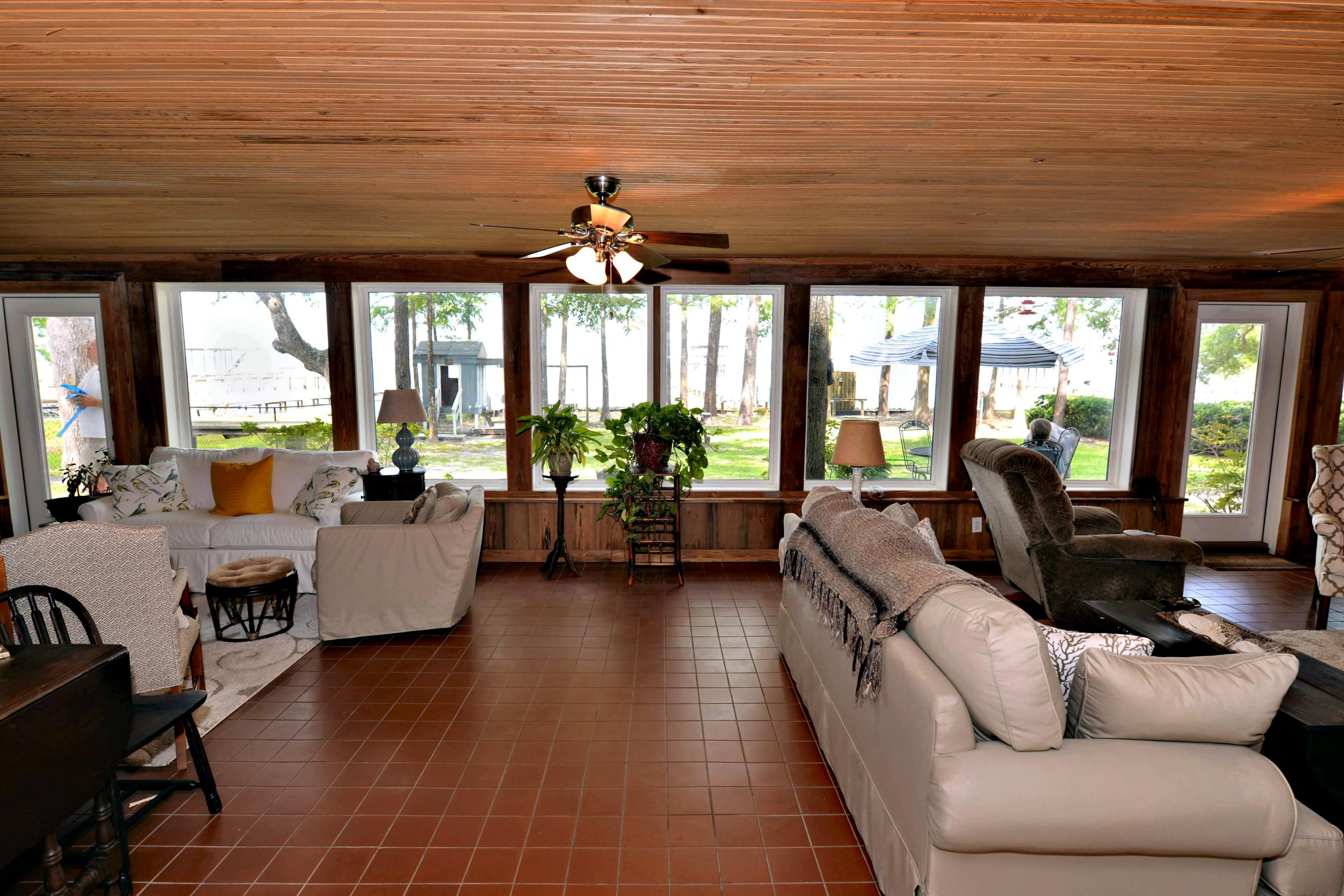 2394 Bay Grove Road Freeport, FL 32439 - Photo 8 of 37 a living room with furniture and a large window