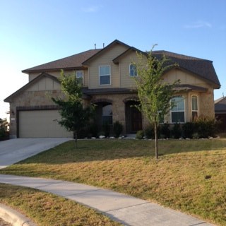 a view of a house with a tree