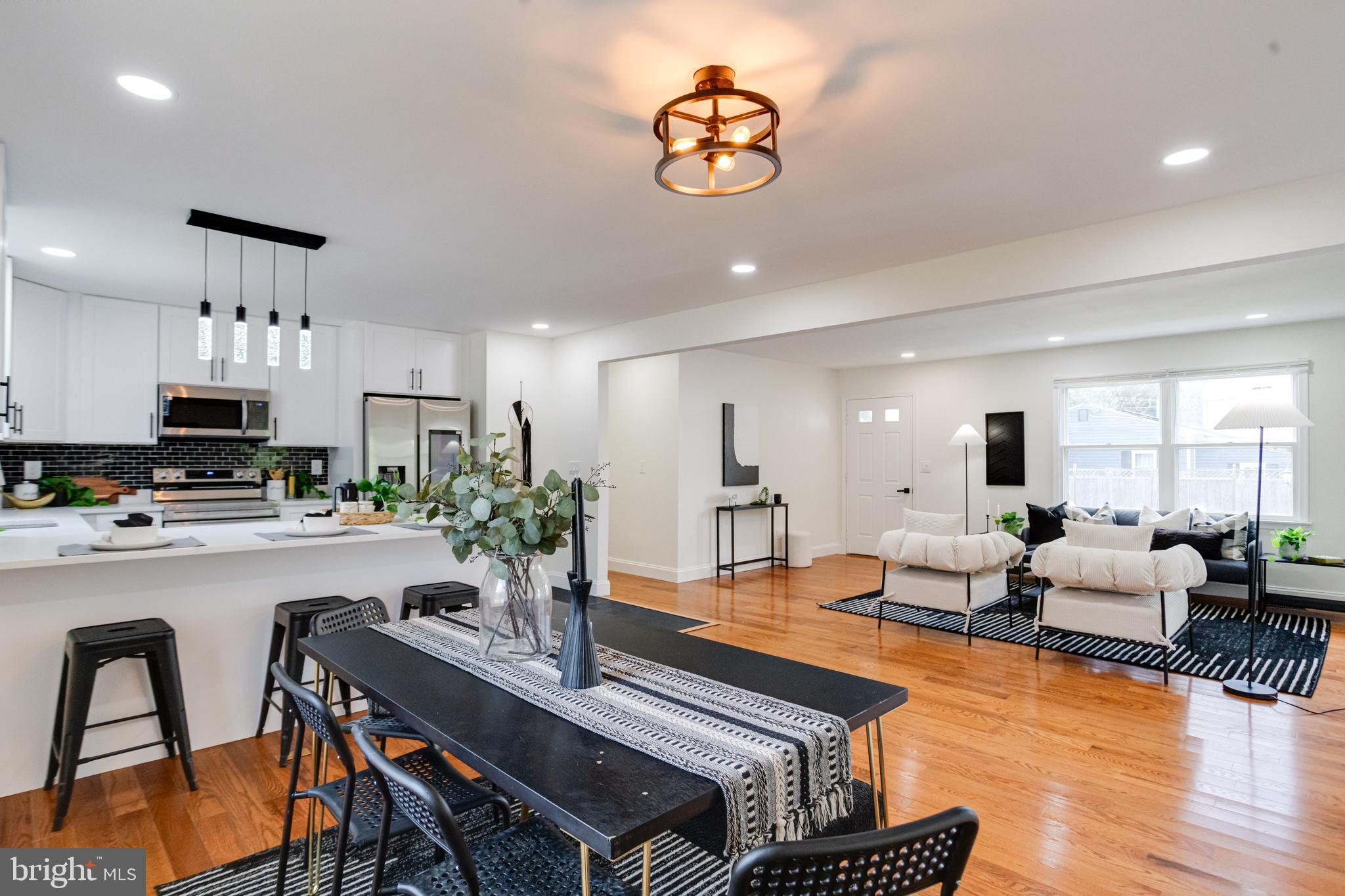 8041 Edgewater Avenue Rosedale, MD 21237 - Photo 13 of 38 a living room with furniture a dining table and chairs