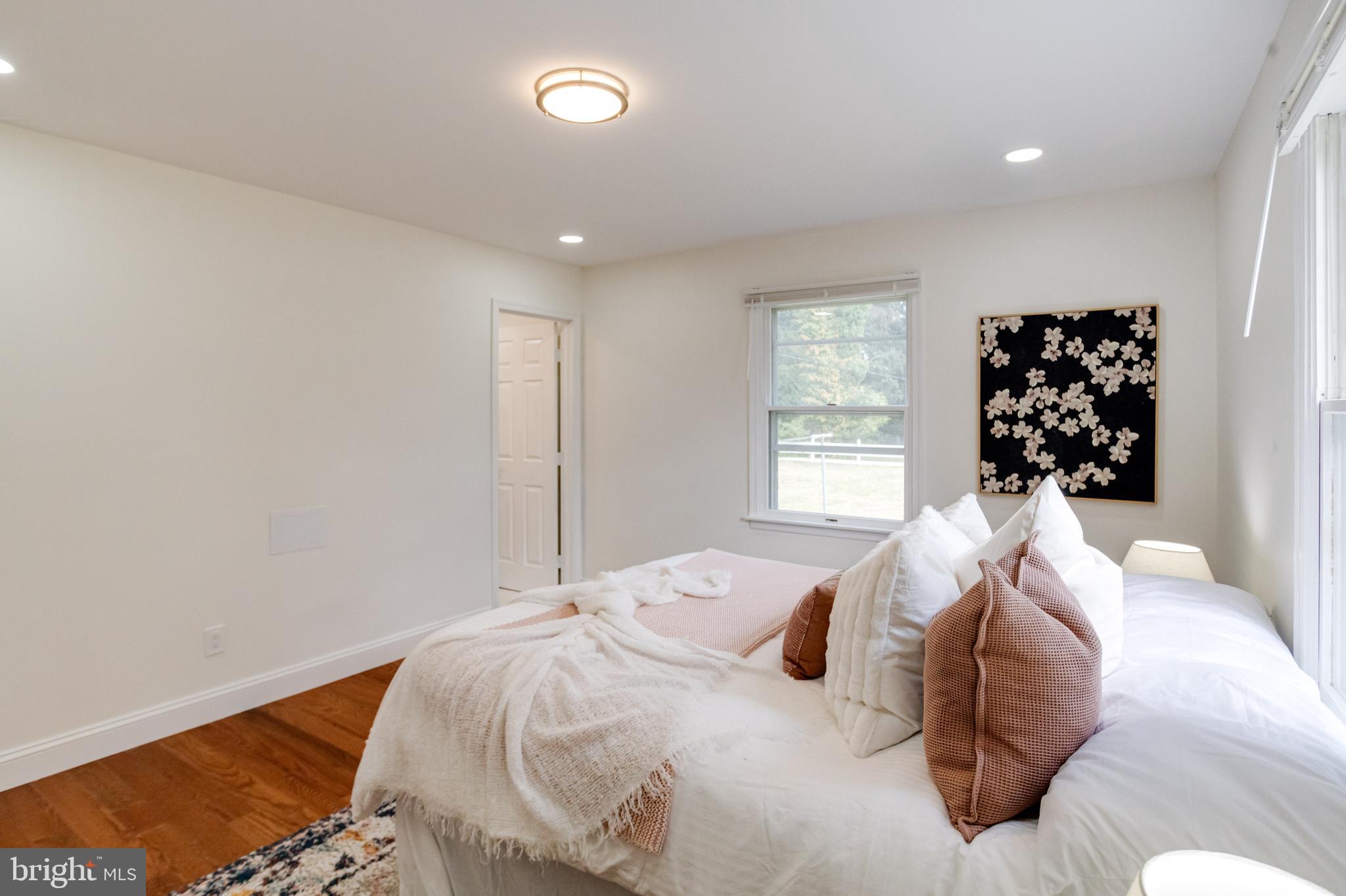 8041 Edgewater Avenue Rosedale, MD 21237 - Photo 15 of 38 a bedroom with a bed and a window