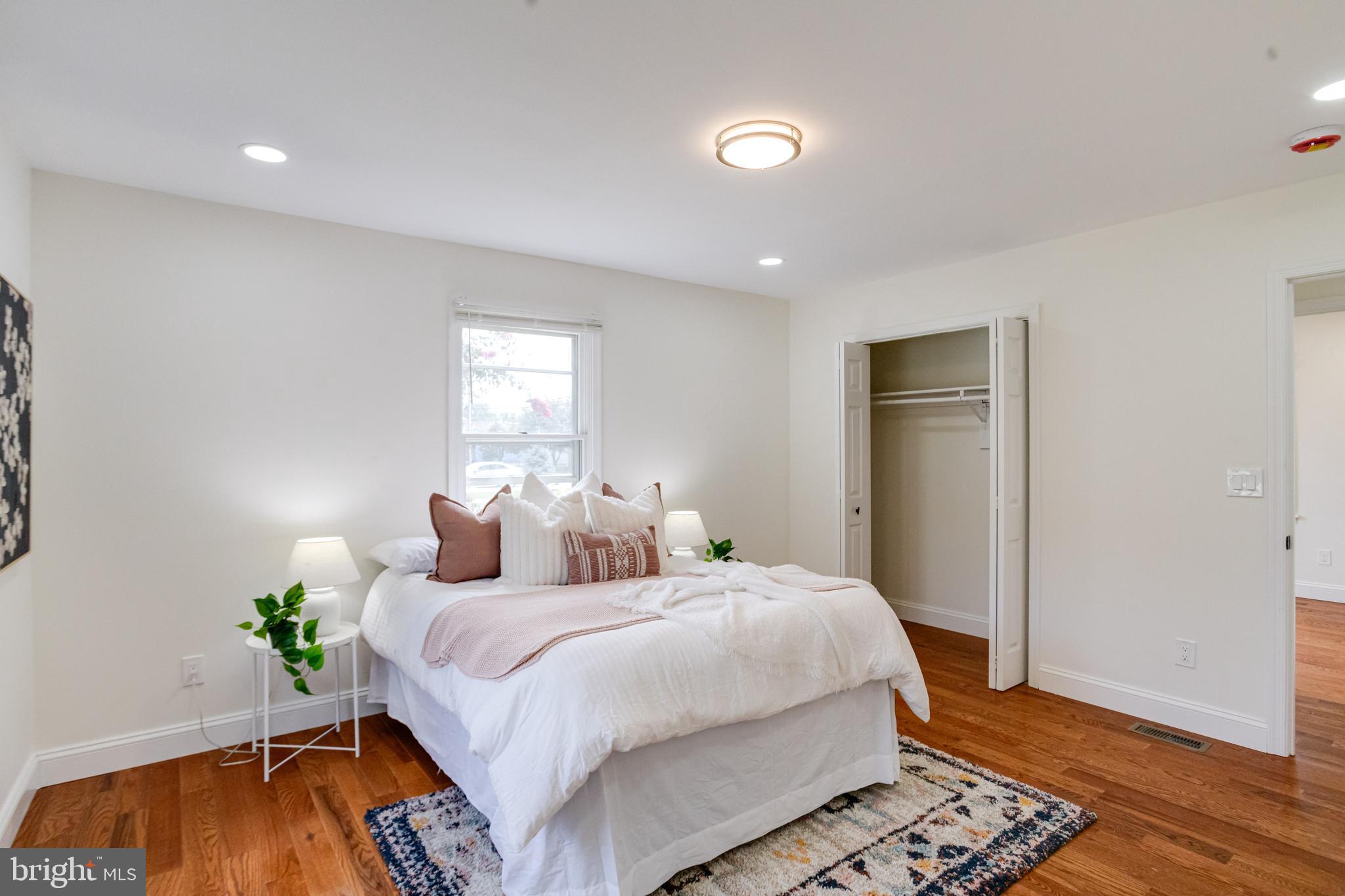 8041 Edgewater Avenue Rosedale, MD 21237 - Photo 16 of 38 a bedroom with bed and wooden floor