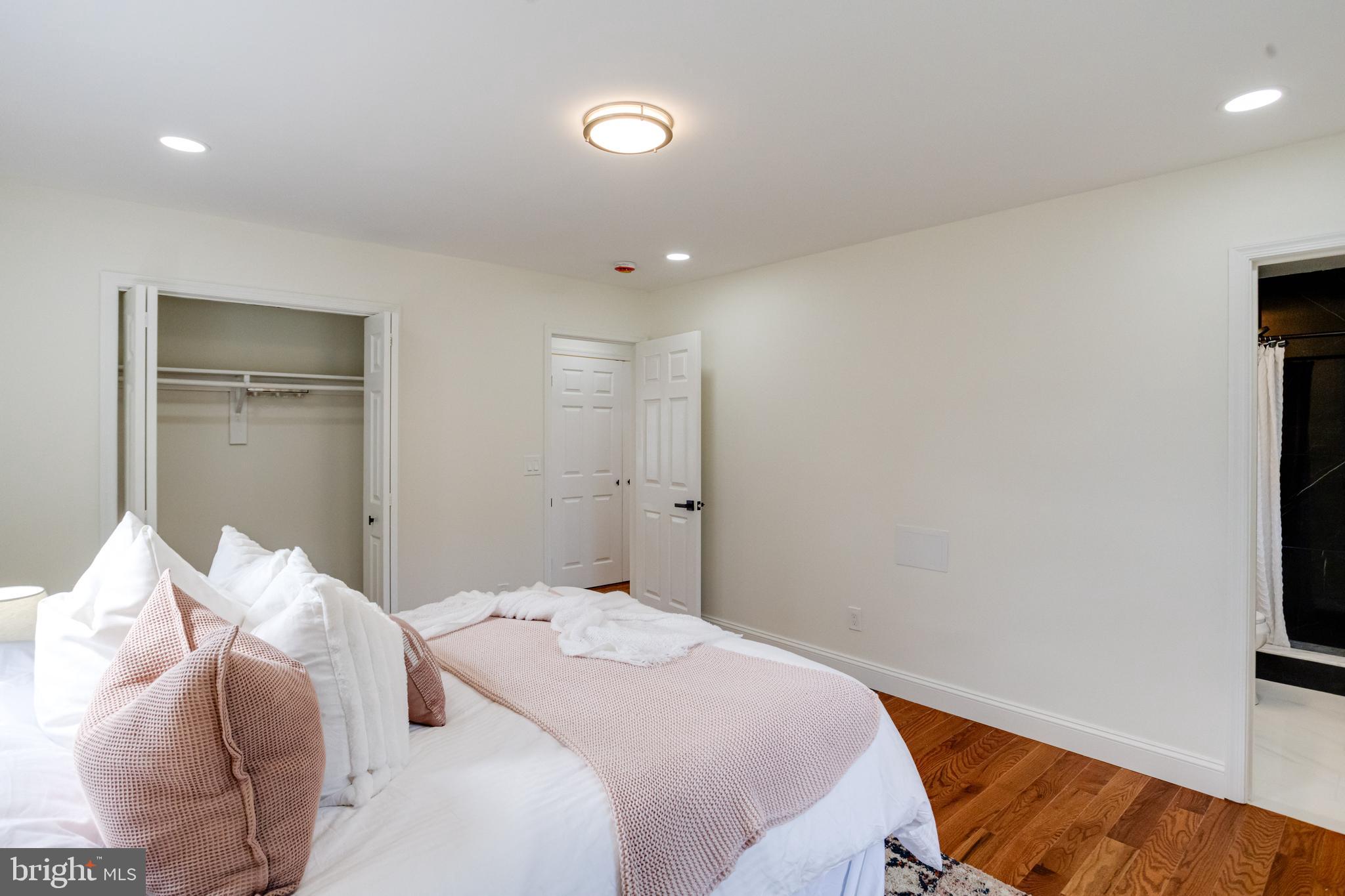 8041 Edgewater Avenue Rosedale, MD 21237 - Photo 17 of 38 a bedroom with a bed and a rug