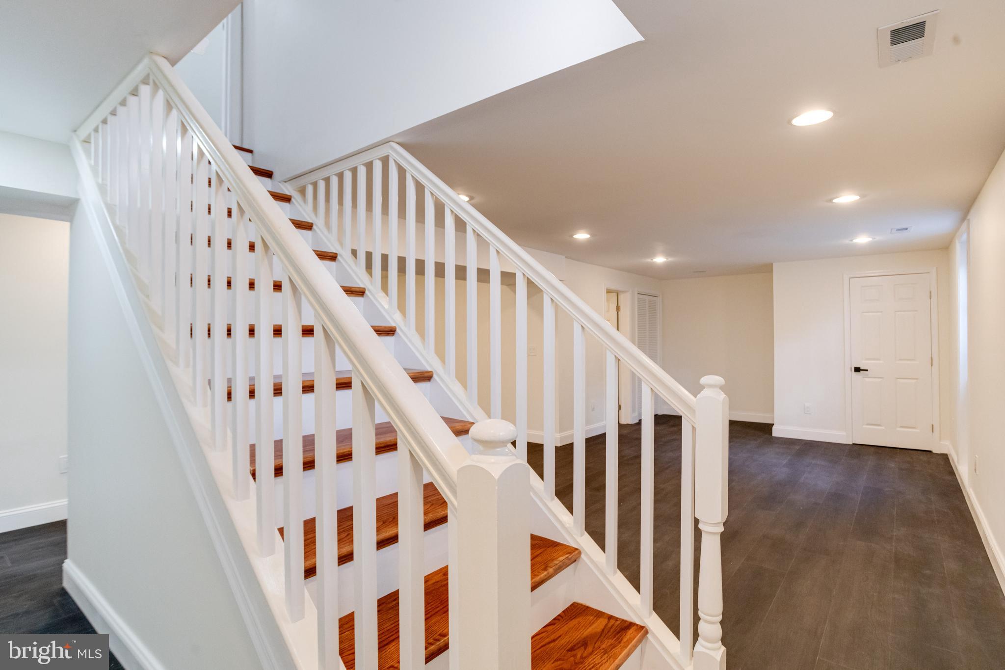8041 Edgewater Avenue Rosedale, MD 21237 - Photo 23 of 38 a view of staircase with wooden floor and white walls