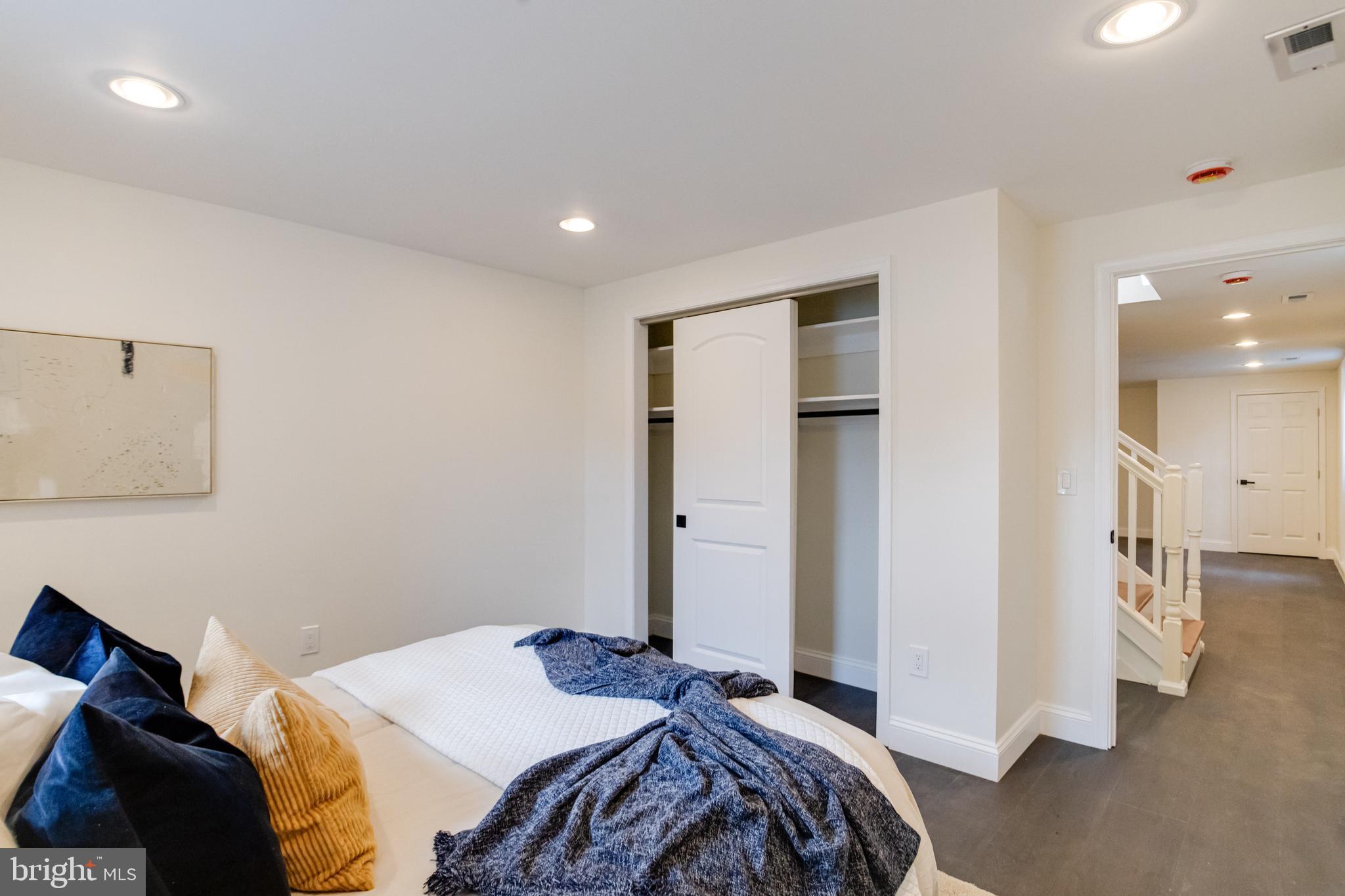 8041 Edgewater Avenue Rosedale, MD 21237 - Photo 32 of 38 a bedroom with a bed and a walk in closet