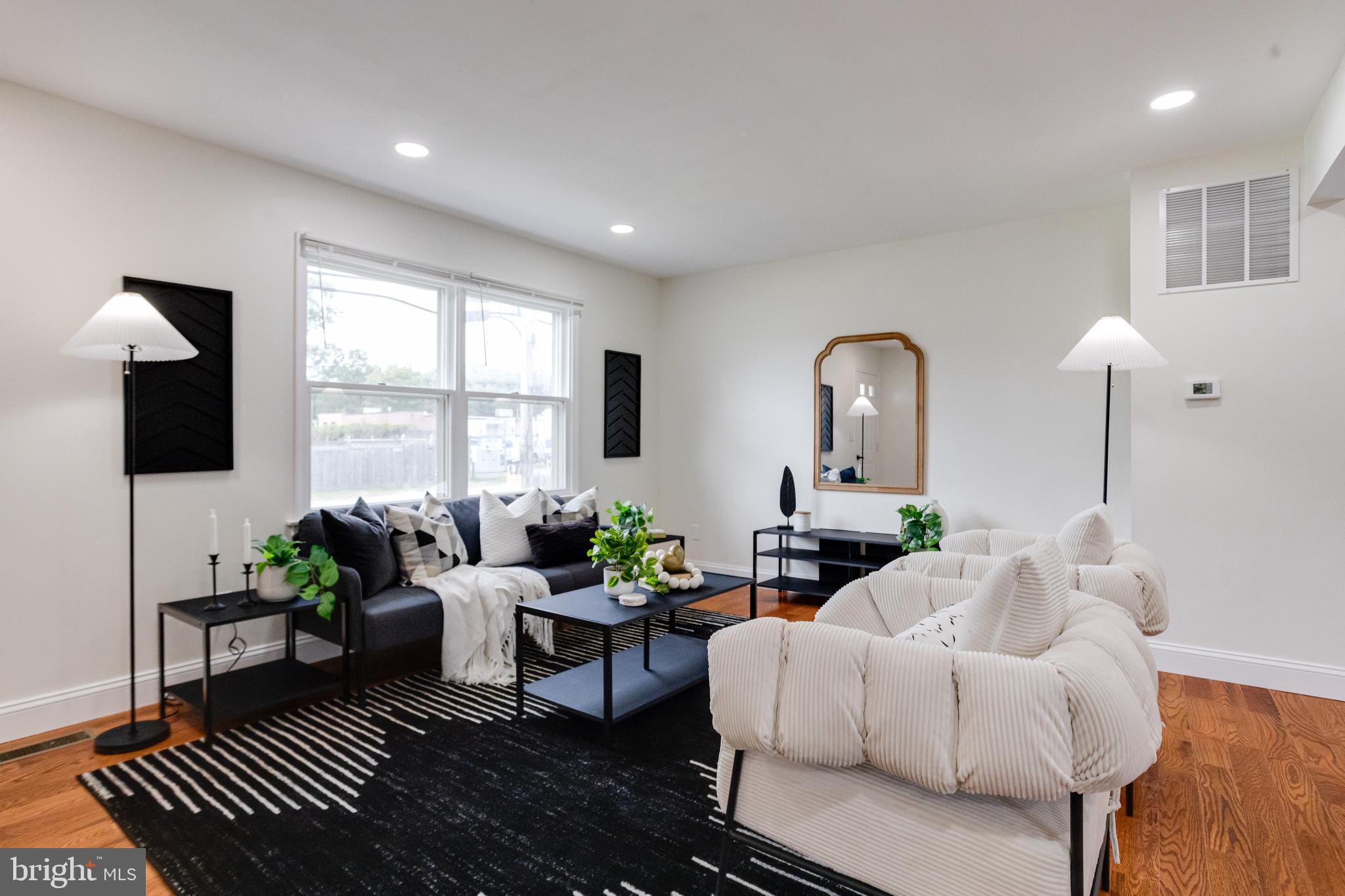 8041 Edgewater Avenue Rosedale, MD 21237 - Photo 5 of 38 a living room with furniture fireplace and a flat screen tv