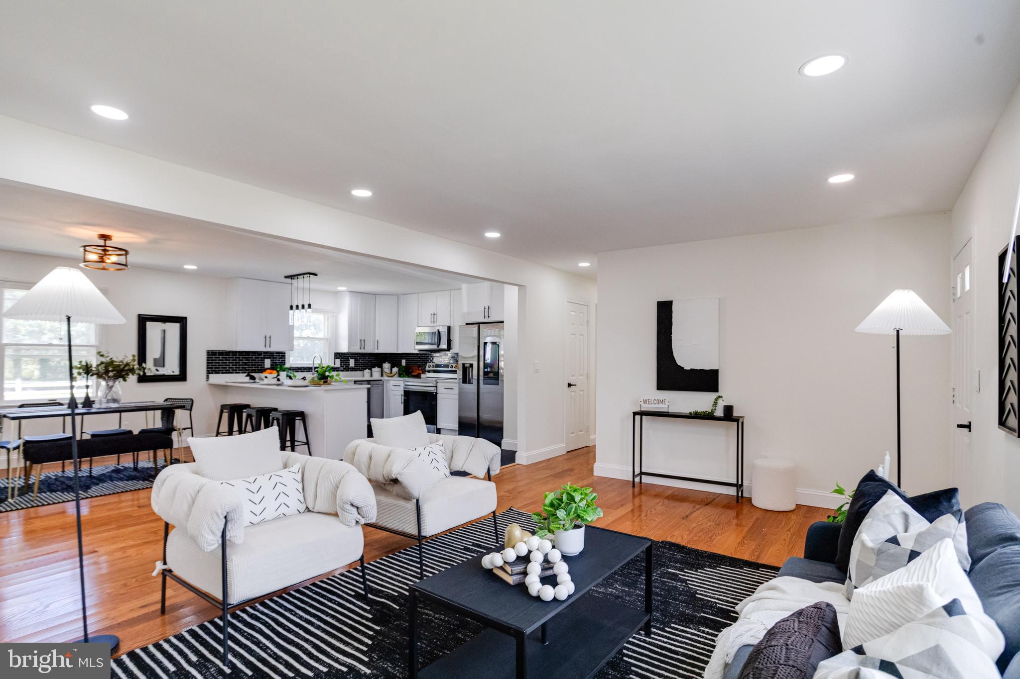 8041 Edgewater Avenue Rosedale, MD 21237 - Photo 7 of 38 a living room with furniture a lamp and a table