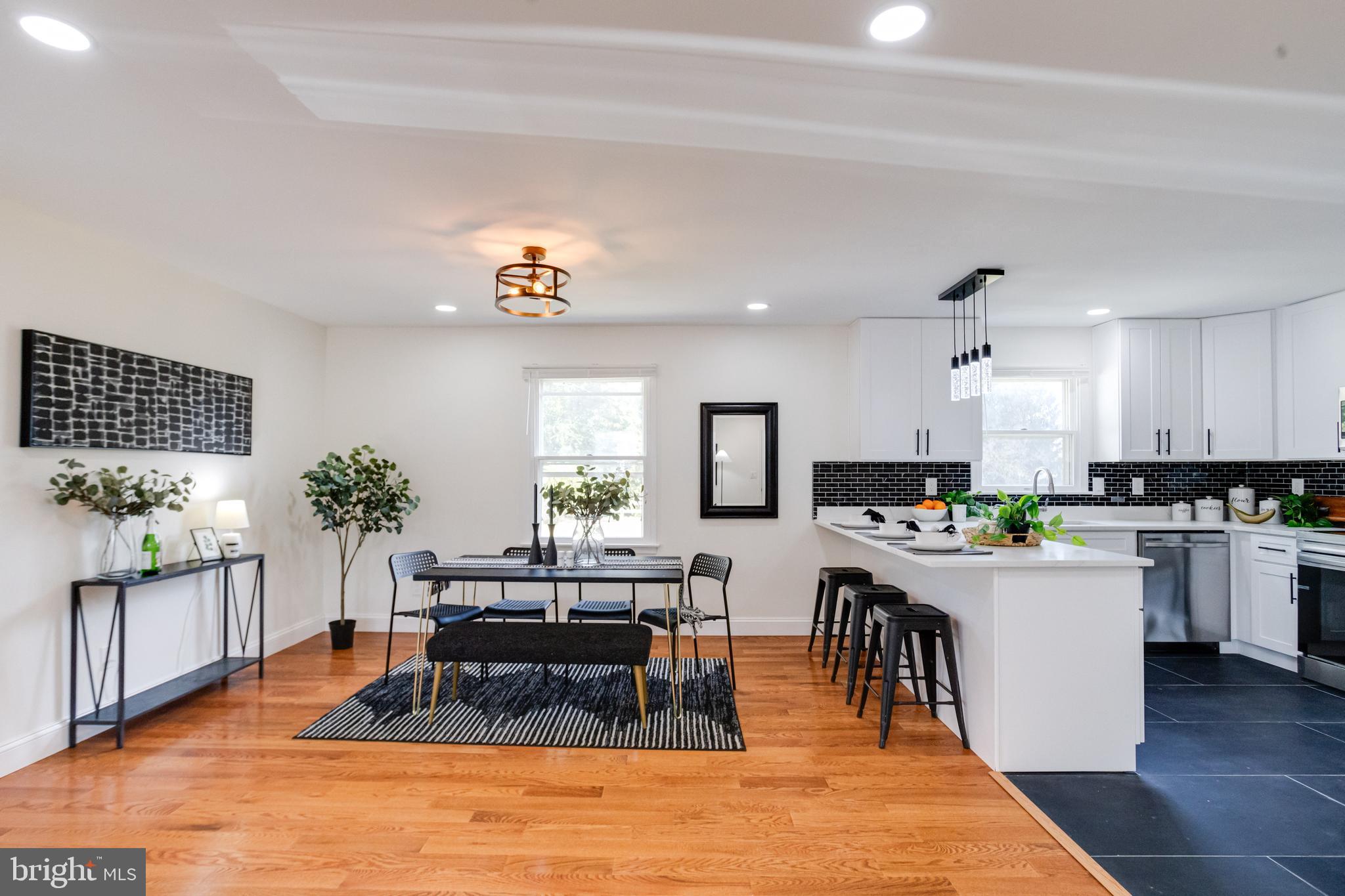 8041 Edgewater Avenue Rosedale, MD 21237 - Photo 9 of 38 a living room with furniture a potted plant and kitchen view