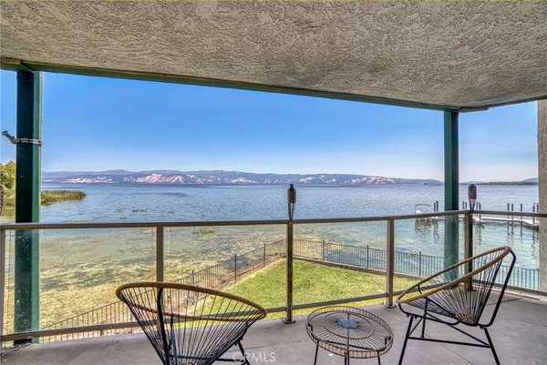 a view of a balcony with chair and table