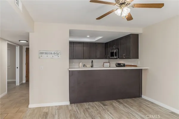 a view of cabinets and wooden floor