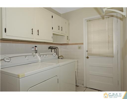 5 Roney Road Edison, NJ 08820 - Photo 15 of 25 a view of a sink and cabinets