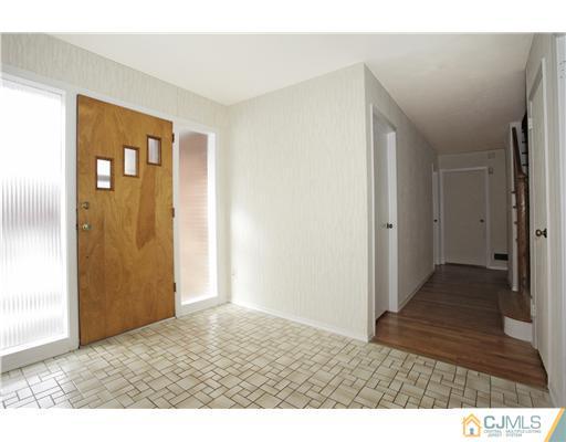 5 Roney Road Edison, NJ 08820 - Photo 7 of 25 a view of hallway with wooden floor