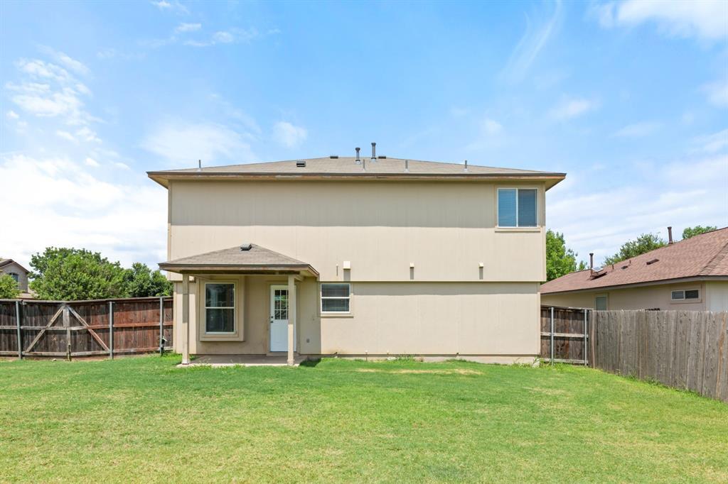 2700 Breezy Point Cove Round Rock, TX 78665 - Photo 24 of 26 a view of a house with backyard porch and wooden fence