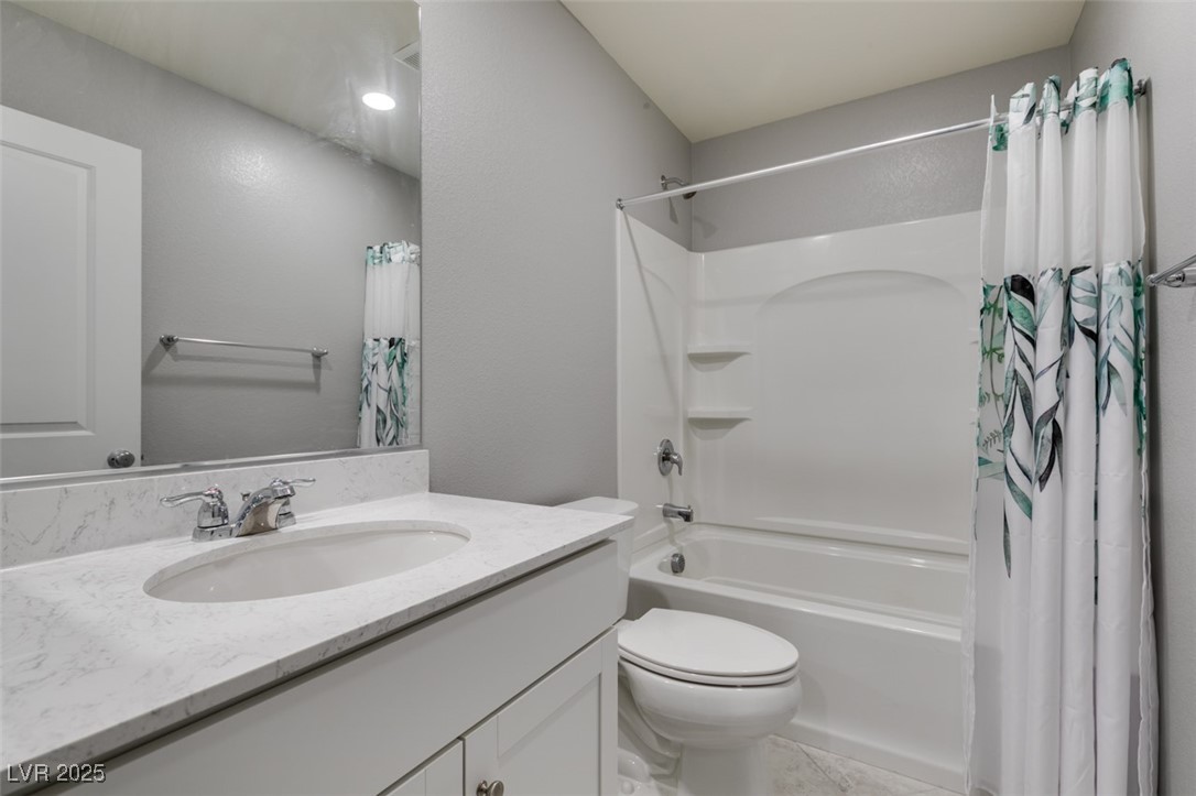 2870 Turnstone Ridge Street Henderson, NV 89044 - Photo 31 of 50 Full bathroom with vanity, shower / tub combo, and toilet
