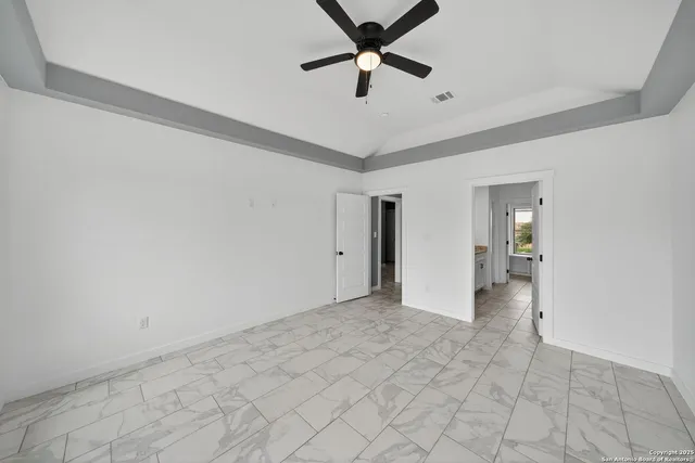 a view of an empty room and window