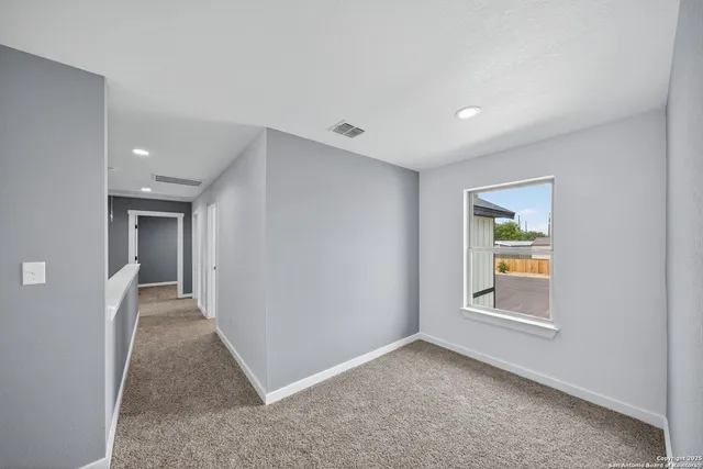a view of an empty room and window
