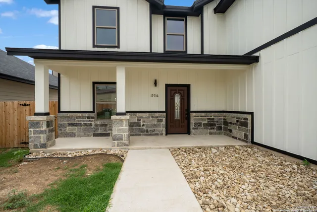 front view of a house with a rug