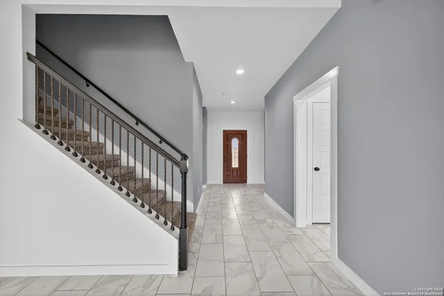 a view of a hallway with staircase