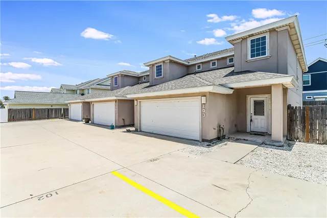 a view of a house with a snow in the yard