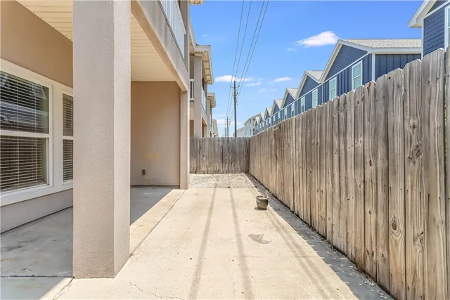 a view of balcony with wooden floor