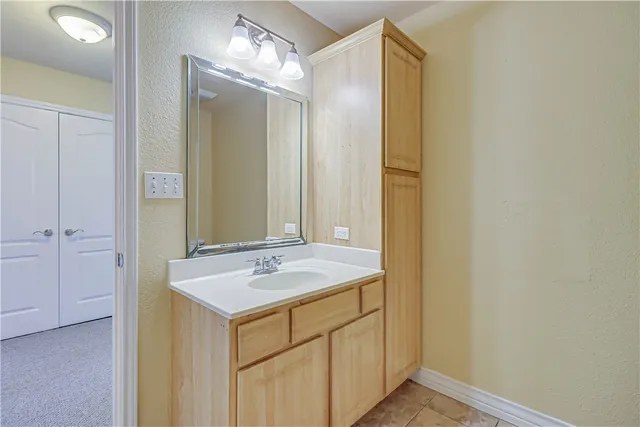 a bathroom with a sink and a mirror