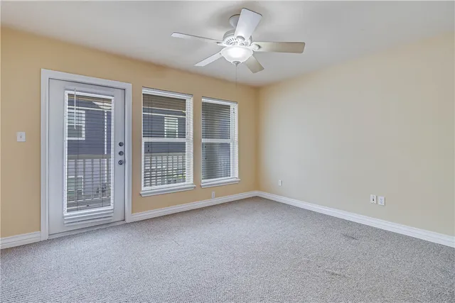 a view of empty room with windows