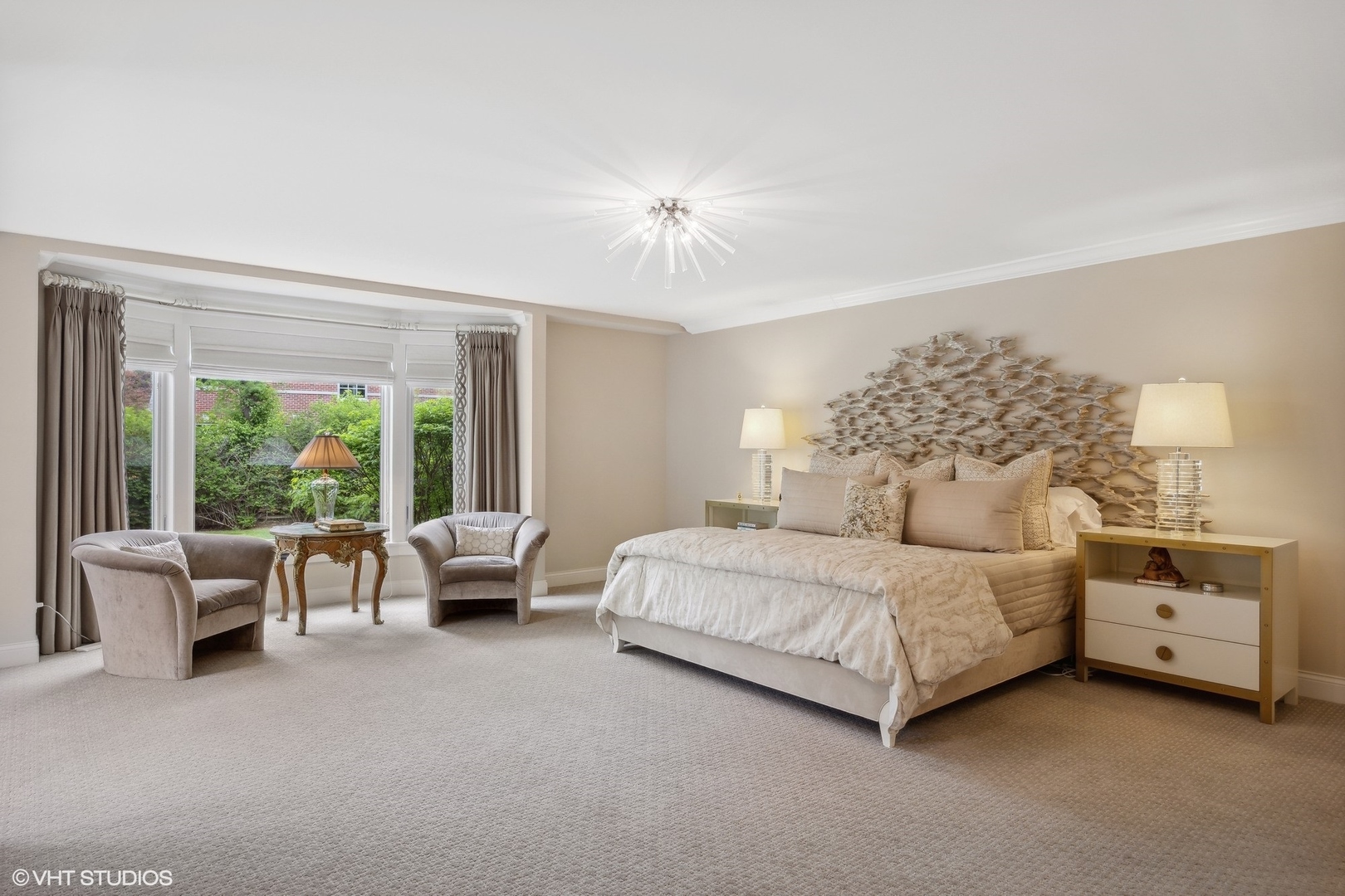 17 Meadowview Road Northfield, IL 60093 - Photo 26 of 50 a spacious bedroom with a bed and a chandelier