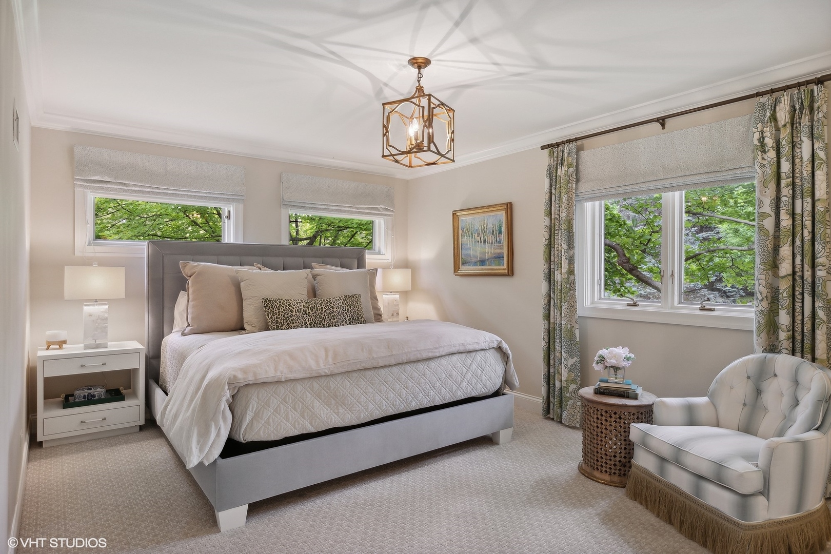 17 Meadowview Road Northfield, IL 60093 - Photo 33 of 50 a spacious bedroom with a bed and a chandelier