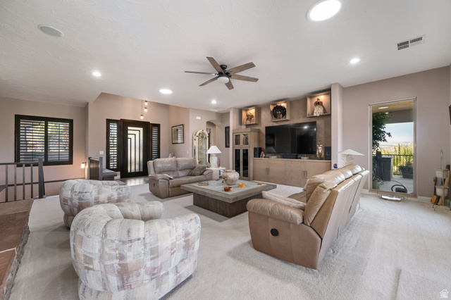 2376 Stone Crest Circle St. George, UT 84790 - Photo 7 of 61 Living area featuring a ceiling fan and arched walkways