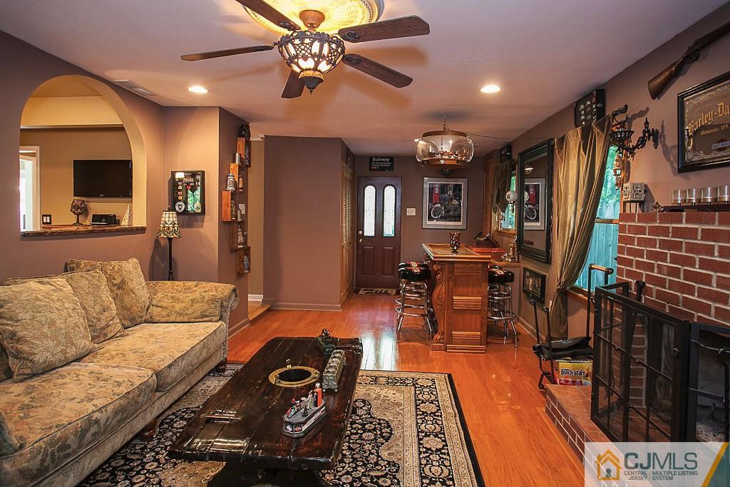 68 Richard Road Edison, NJ 08820 - Photo 20 of 25 a living room with furniture and wooden floor