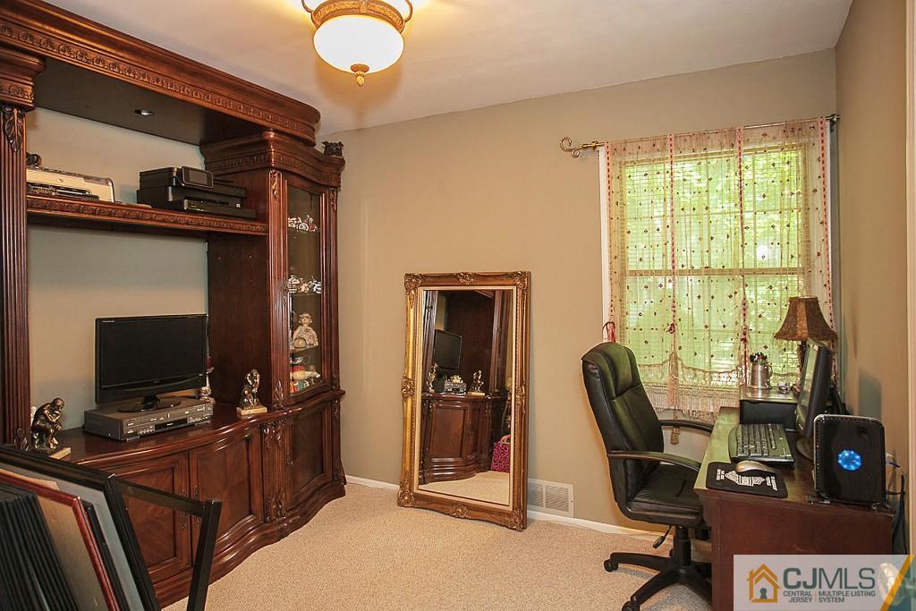 68 Richard Road Edison, NJ 08820 - Photo 22 of 25 a view of a workspace with furniture and a window
