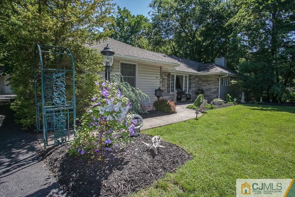 68 Richard Road Edison, NJ 08820 - Photo 4 of 25 a view of a backyard with sitting area and garden