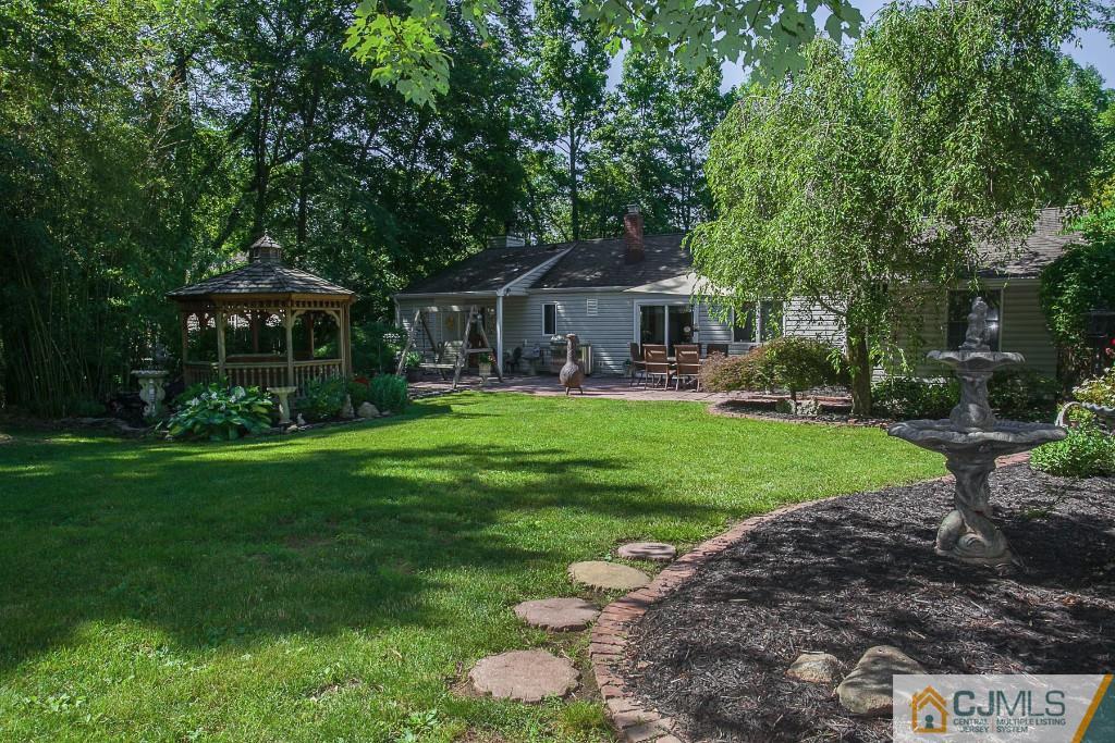 68 Richard Road Edison, NJ 08820 - Photo 6 of 25 a front view of a house with a yard and green space
