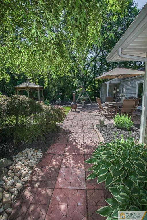 68 Richard Road Edison, NJ 08820 - Photo 7 of 25 a front view of house with yard and green space