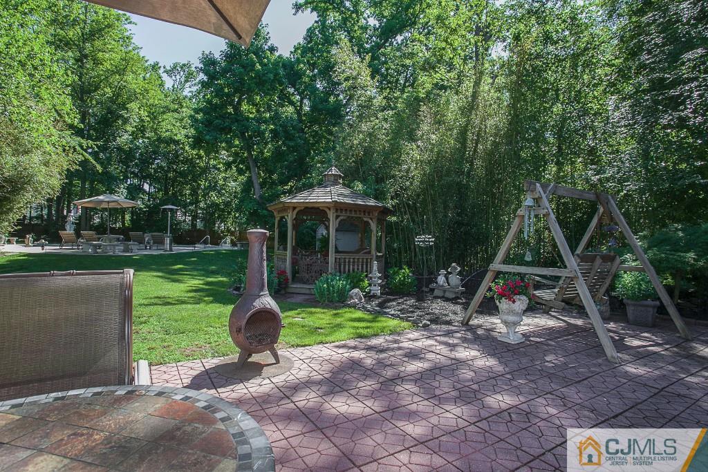 68 Richard Road Edison, NJ 08820 - Photo 8 of 25 a view of a chair and table in the garden
