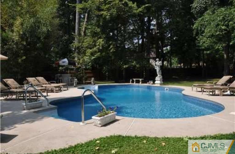 68 Richard Road Edison, NJ 08820 - Photo 9 of 25 a view of a backyard with swimming pool