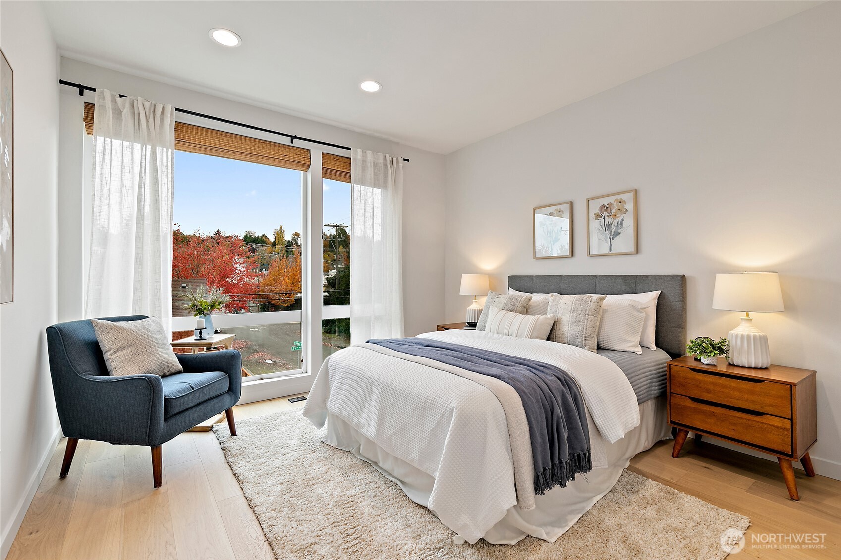 4100 37th Avenue South Seattle, WA 98118 - Photo 14 of 19 a spacious bedroom with a bed and a couch